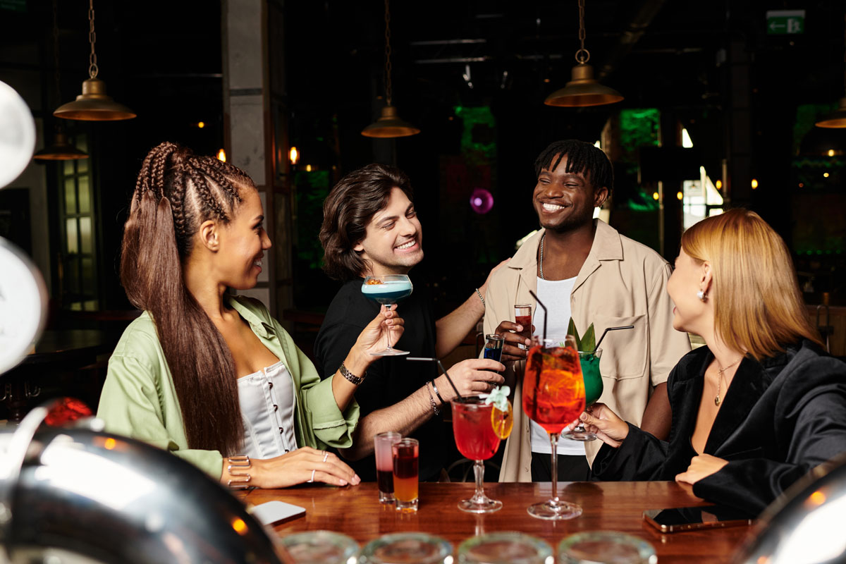 friends-enjoying-colorful-cocktails-at-an-urban-ba-2026-03-12-22-44-34-utc